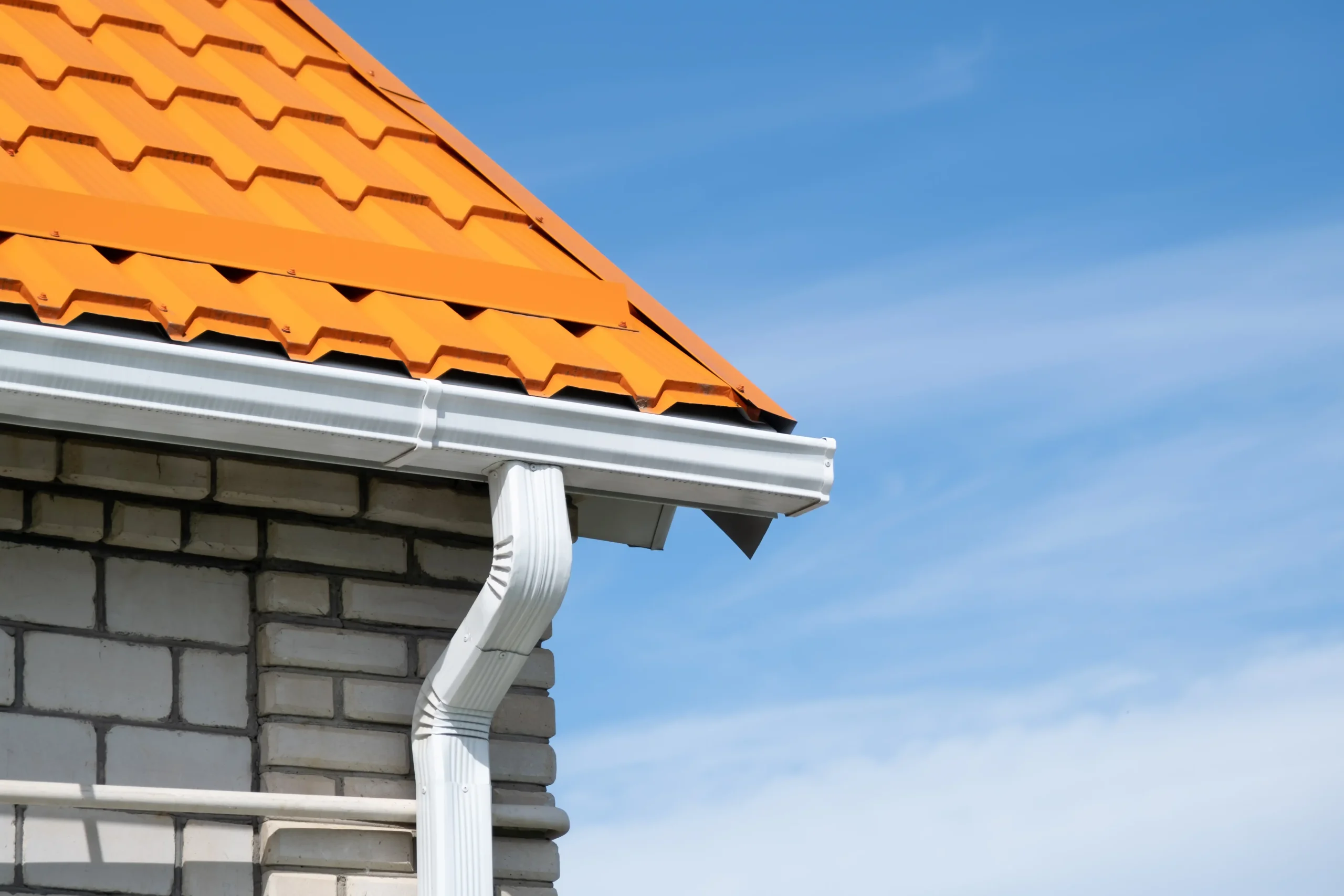 rain-gutter-pipeline-system-on-brick-house-brigh-2026-01-09-11-55-24-utc